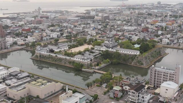 Imabari Castle and City, Aerial Tilt Reveals Japan Inland Sea