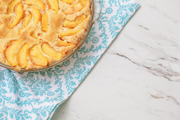 Closeup of Homemade Peach Cake on a Turquoise and White Towel