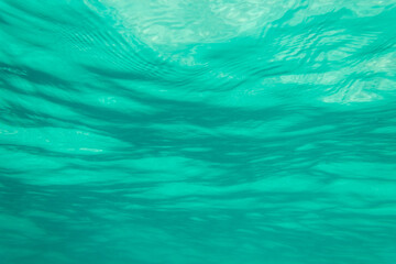 Fototapeta na wymiar look at the waves from under the water, azure sea, use as a background or texture