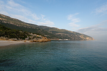 Paradise idylic Coelhos beach with turquoise water in Arrabida park, in Portugal