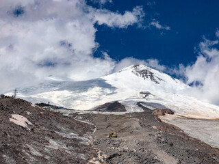 A lifeless landscape high in the mountains, rocks and snow. Elbrus The Great Caucasus Range.
