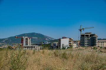 Fototapeta na wymiar Stepanakert, Artsakh (Nagorno-Karabakh), 7 August 2017. Construction of new residential apartments on the outskirts of Stepanakert, capital city of the self-proclaimed Republic of Artsakh.