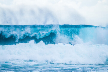 Beautiful Tropical Island Paradise Photo of Clear Aqua Blue Ocean Wave Crashing on Rocks with Sun...