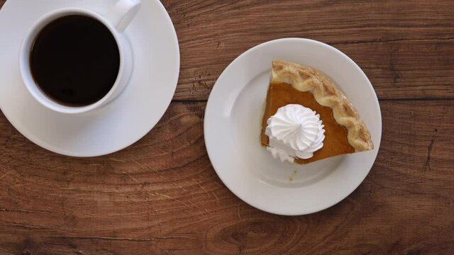 Eating a Slice of Pumpkin Pie and Coffee