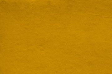 Obraz premium Vintage and old looking paper background. Colored gold with a brown retro book cover. Ancient book page.