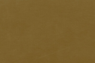 Vintage and old looking paper background. Colored gold with a brown retro book cover. Ancient book page.