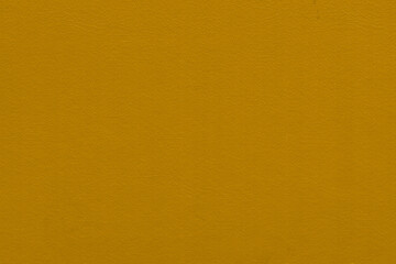 Vintage and old looking paper background. Colored gold with a brown retro book cover. Ancient book page.