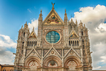 Fototapeta na wymiar Facade of the gothic Cathedral of Siena, Tuscany, Italy