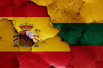 flags of Spain and Lithuania painted on cracked wall