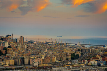 Genoa, Italy - 09 15 2020: Aerial view of the harbor at sunset. Time lapse. 