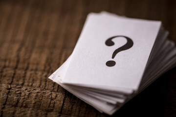 Question Mark Stack On Wooden Background
