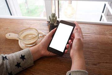 Mockup picture of business woman’s hands/man's hands holding smart phone with white blank screen...