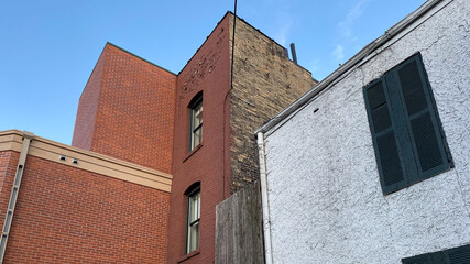 old brick buildings black shutters