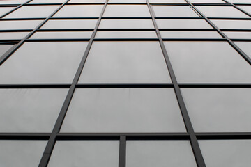 The blue glass facade of a high-rise building. Texture for the background.