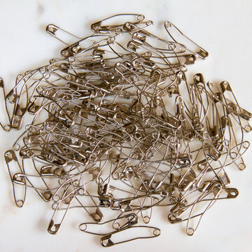Pile Of Quilting Pins Arranged Artistically.