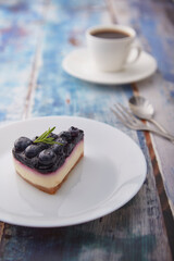 Cheesecake blueberry on wooden table