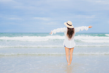 Portrait beautiful young asian woman relax smile around beach sea ocean