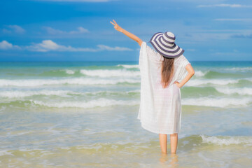 Portrait beautiful young asian woman relax smile around beach sea ocean