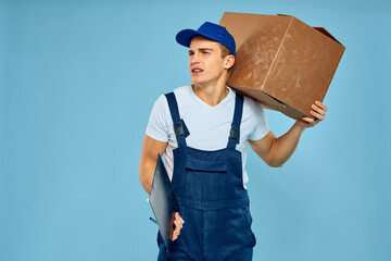Man worker with cardboard box delivery loader lifestyle blue background