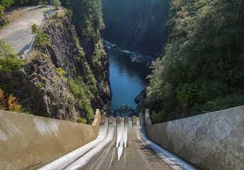 Cleveland Dam by Capilano Lake in North Vancouver, BC. The aerial view on dam and surrounding rocky...