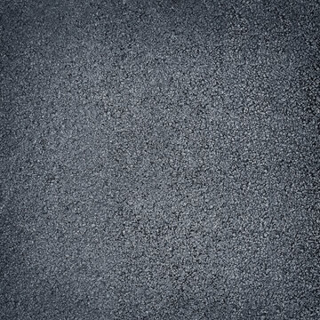 Dark gray surface of rubber pellets in treadmill athletics field texture abstract background
