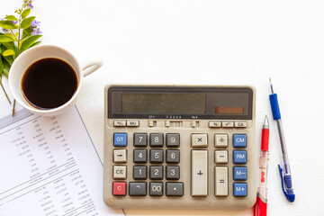 financial statement for check with calculator for business work of personal arrangement flat lay style at office desk