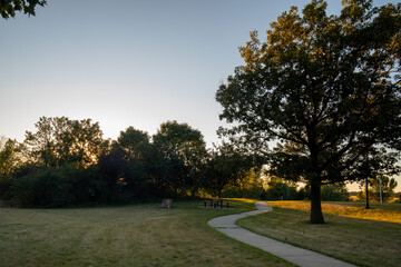 Fototapeta premium A trail and sunset in a highway rest area in Minnesota
