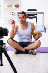 Fototapeta na wymiar Young male blogger in dieting concept
