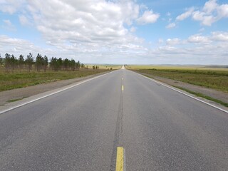 Empty asphalt road in the steppe