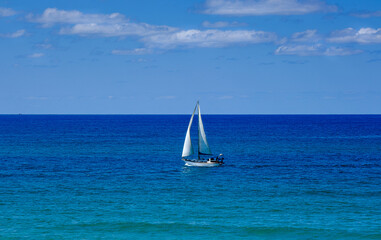 A lonely white yacht at opened sea