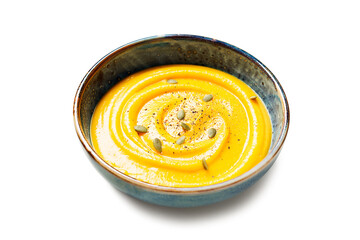 Roasted pumpkin or carrot soup with  pumpkin seeds  isolated on white background