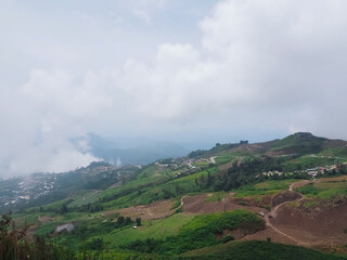 Phu Thap Berk and Khao Kho taken in a panoramic view with a view of green mountains and thick fog.