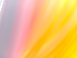 abstract background of blurred yellow pink gradient.