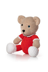 Knitted toy. Brown bear on white background. Full depth of field. With clipping path.