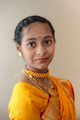 Indian child girl in traditional outfit of state Maharashtra.