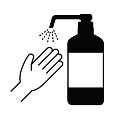 黒のボトルから出たスプレーで手を消毒
