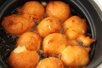 fresh donuts deep-fried in the deep fryer