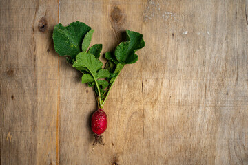 Fresh vegetables in composition on old wooden background