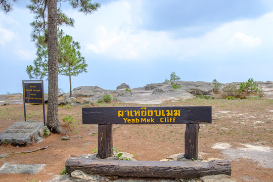 Pha Yeab Mek at Phu Kradueng National Park in Amphoe Phu Kradueng, Loei Province. TEXT TRANSLATION 1: Pha Yeab Mek Cliff, TEXT TRANSLATION 2: Danger Keep a distance from cliff