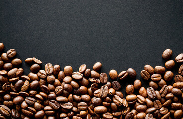 Roasted coffee beans on black background 