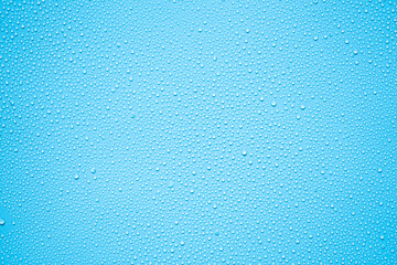 Water or rain drops on blue background 