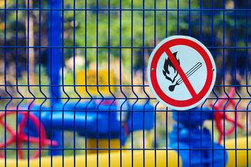 Flammable gas, a sign at a gas distribution station. Warning sign Don't light Fire
