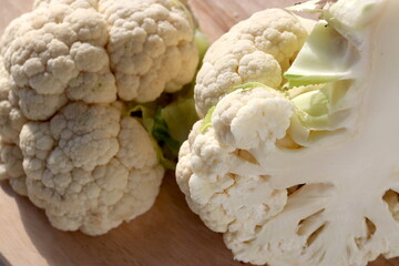 Cauliflower on wooden chopping board