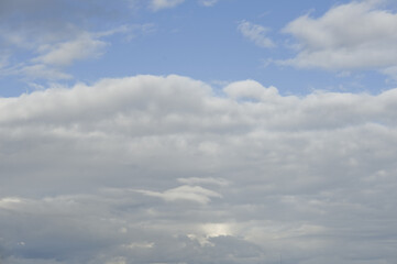 White clouds cumulus floating on blue sky for backgrounds concept