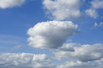 White clouds cumulus floating on blue sky for backgrounds concept