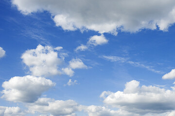 Naklejka na ściany i meble white fluffy clouds on blue sky in summer