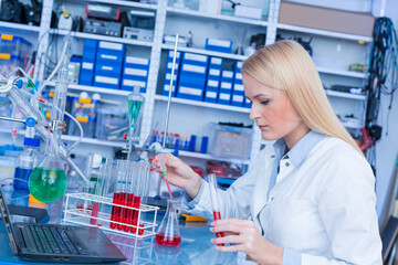 Girl laboratory Assistant.works with an antiviral drug in a laboratory