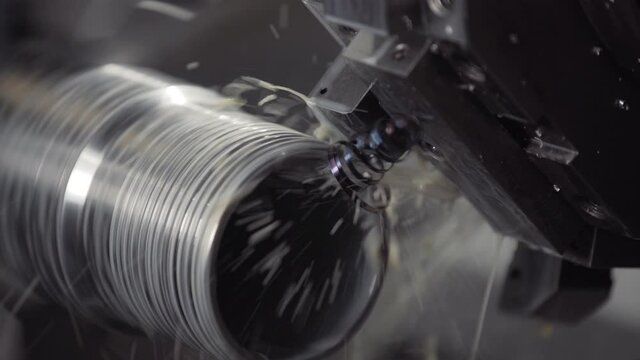 Machining shaft on lathe. metalworking. Turner working on machine. Lathe work. metalworking. Cutting metal modern processing technology. CNC Milling Machine Produces Metal Detail on Factory.