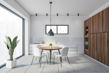 White and wooden dining room interior