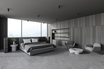 Modern wooden and gray master bedroom corner with armchairs